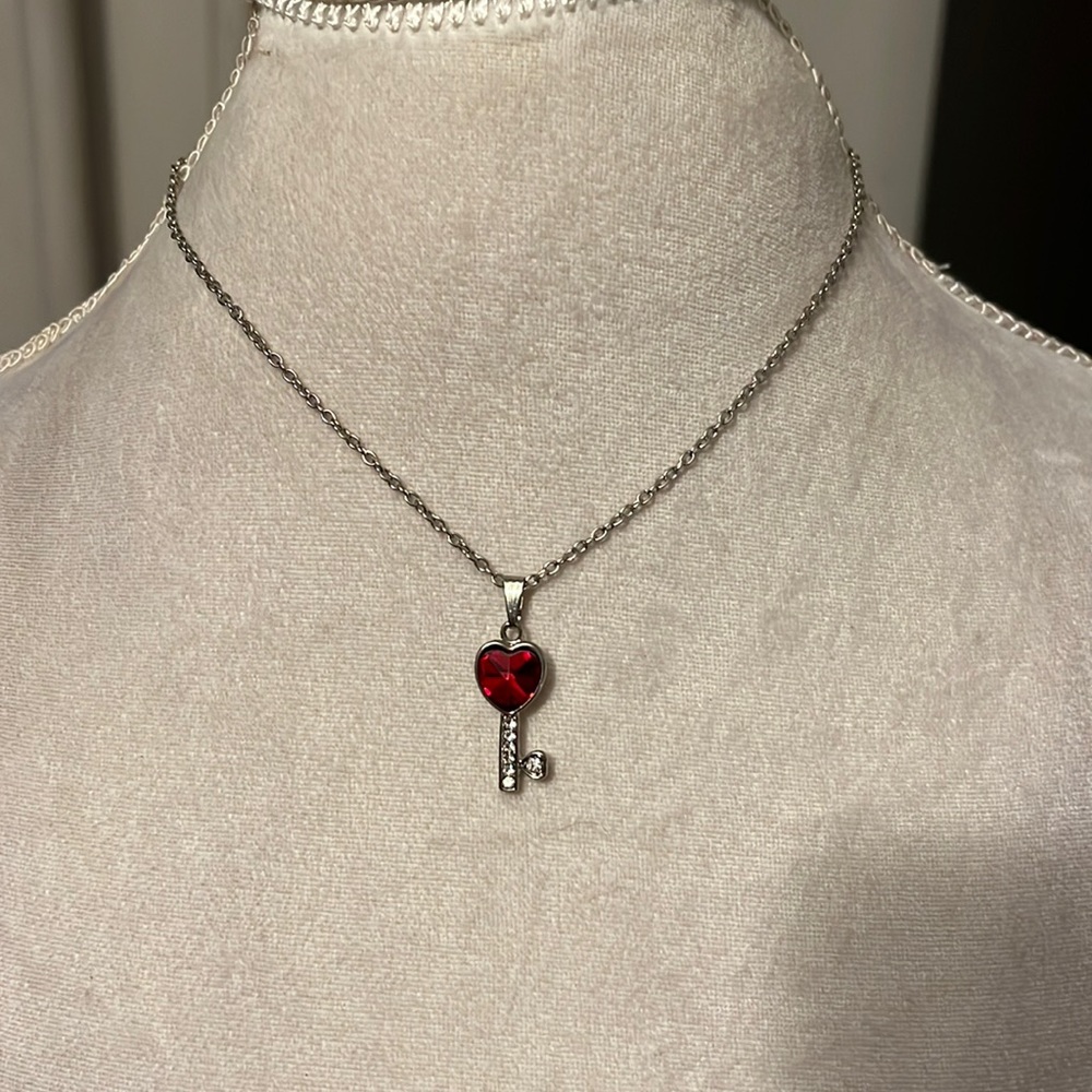 Red gem heart inside a faux diamond shaped key